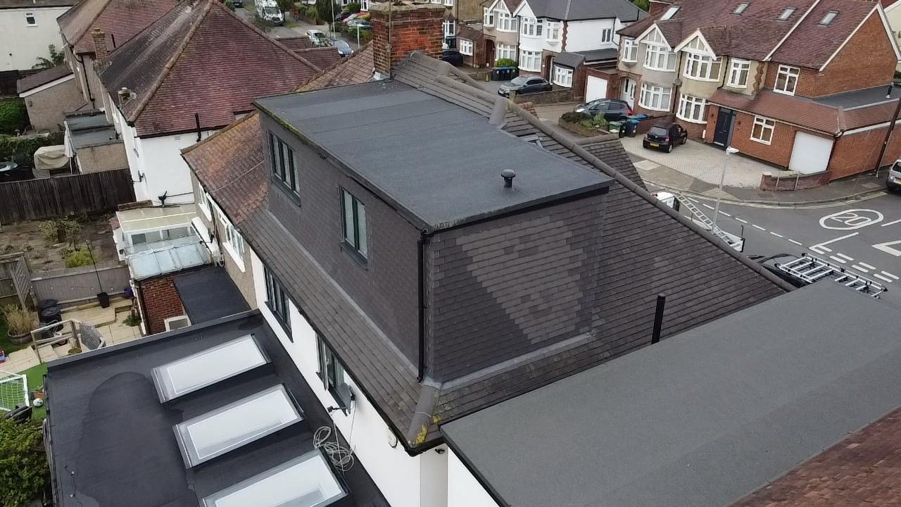 Rear dormer and new flat roof seen from above the street