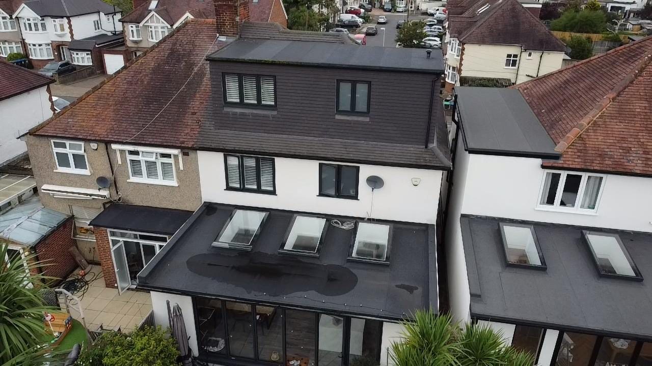 Dormer above a rear extension with three roof lights