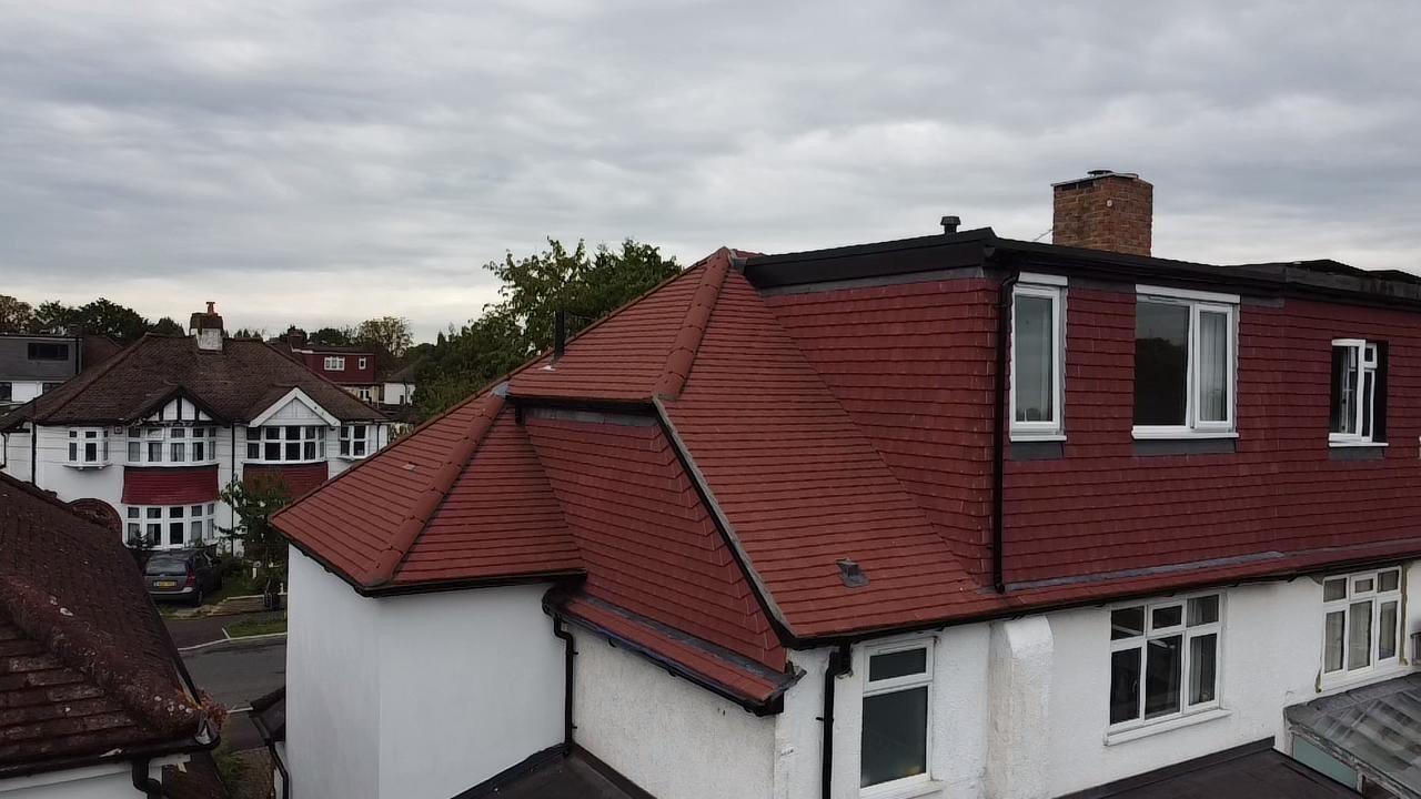 The dormer square-on, tile-hung to match the roof
