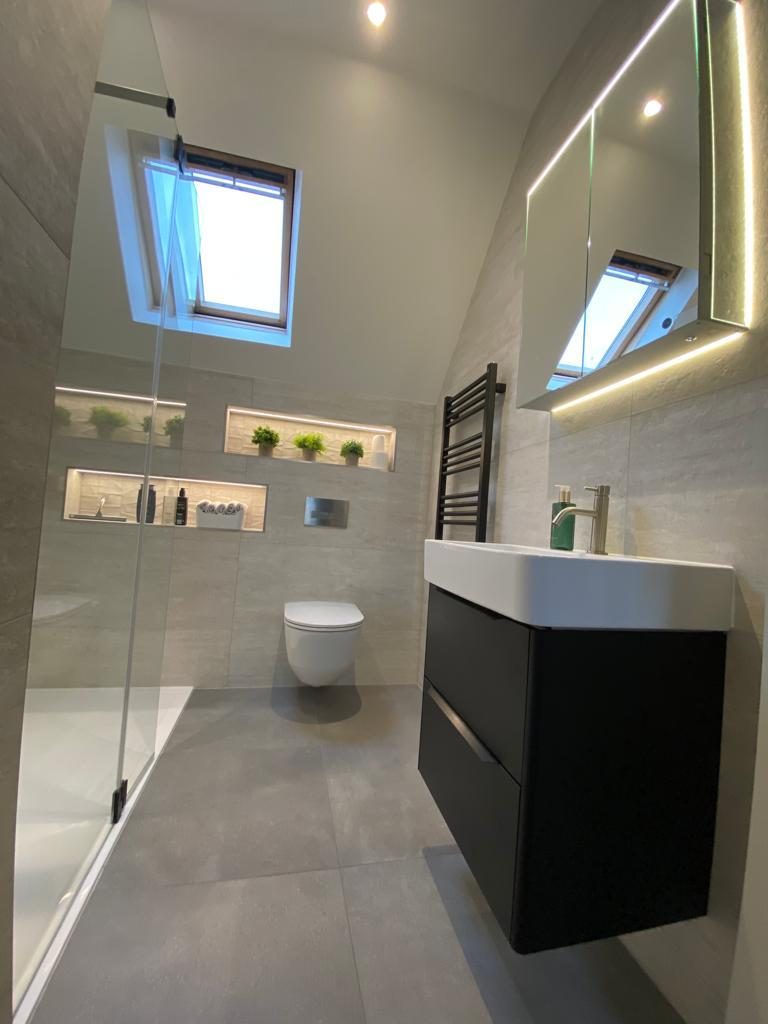 Loft shower room with skylight and lit plant niches, Epsom
