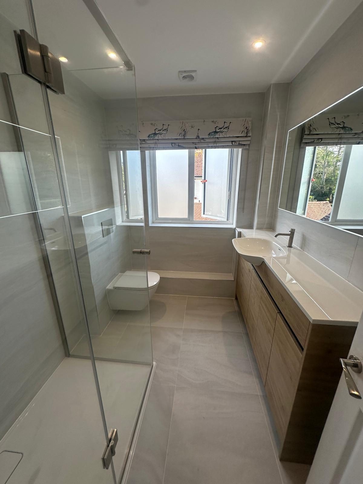 Daylit bathroom with walk-in shower and wood vanity, Lower Kingswood