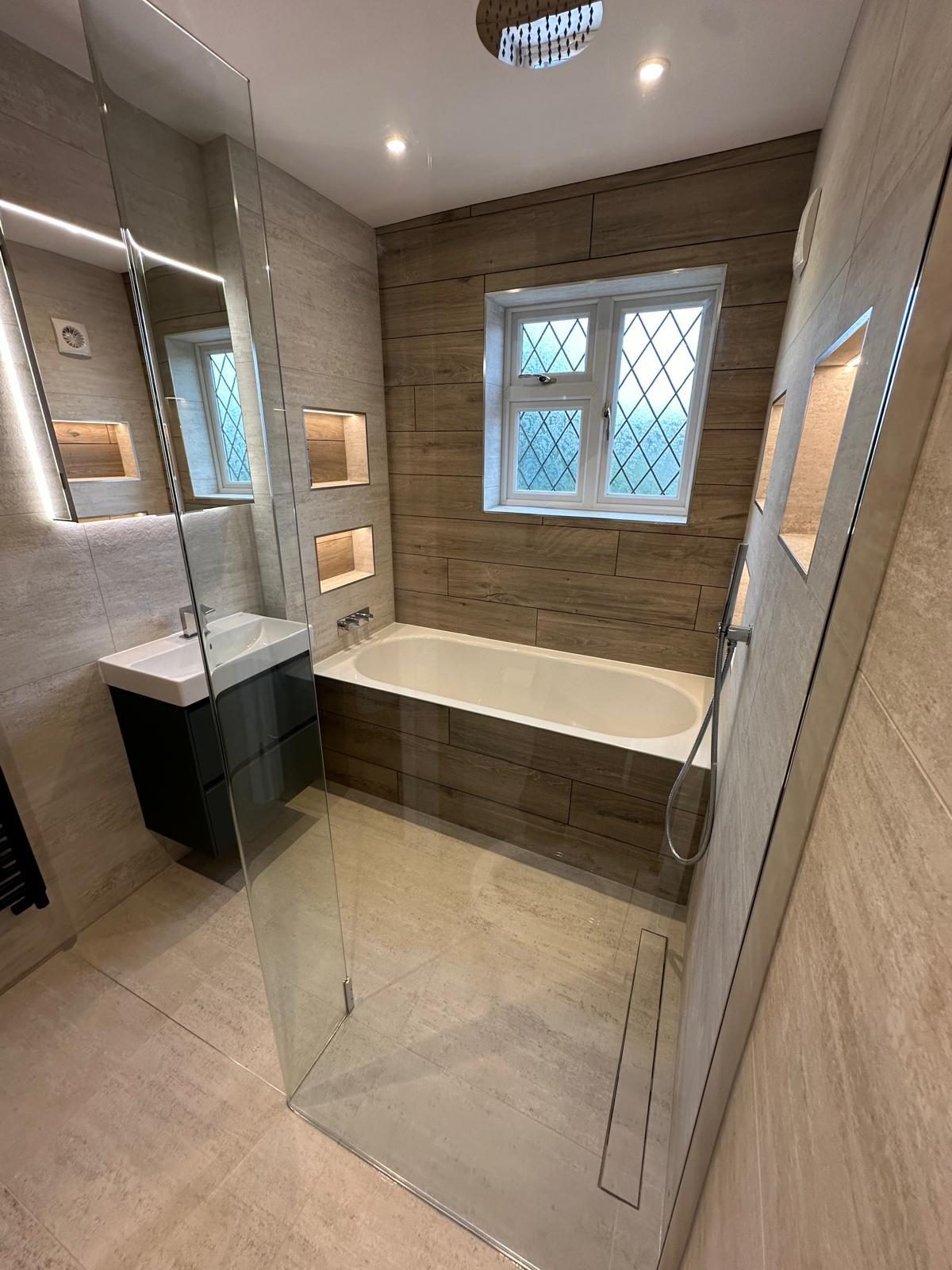 Bathroom with lit niches and a wood-panelled wall, New Malden
