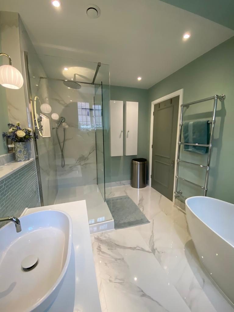 Sage-green bathroom suite with marble walk-in shower and freestanding bath, Tadworth