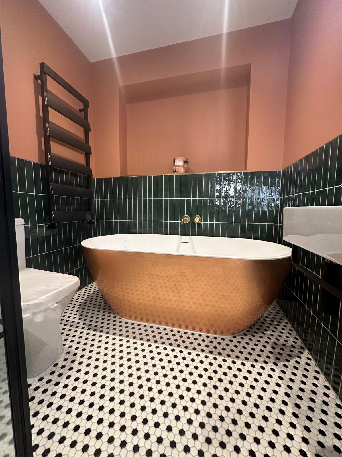 Copper freestanding bath with black towel radiator, Wimbledon