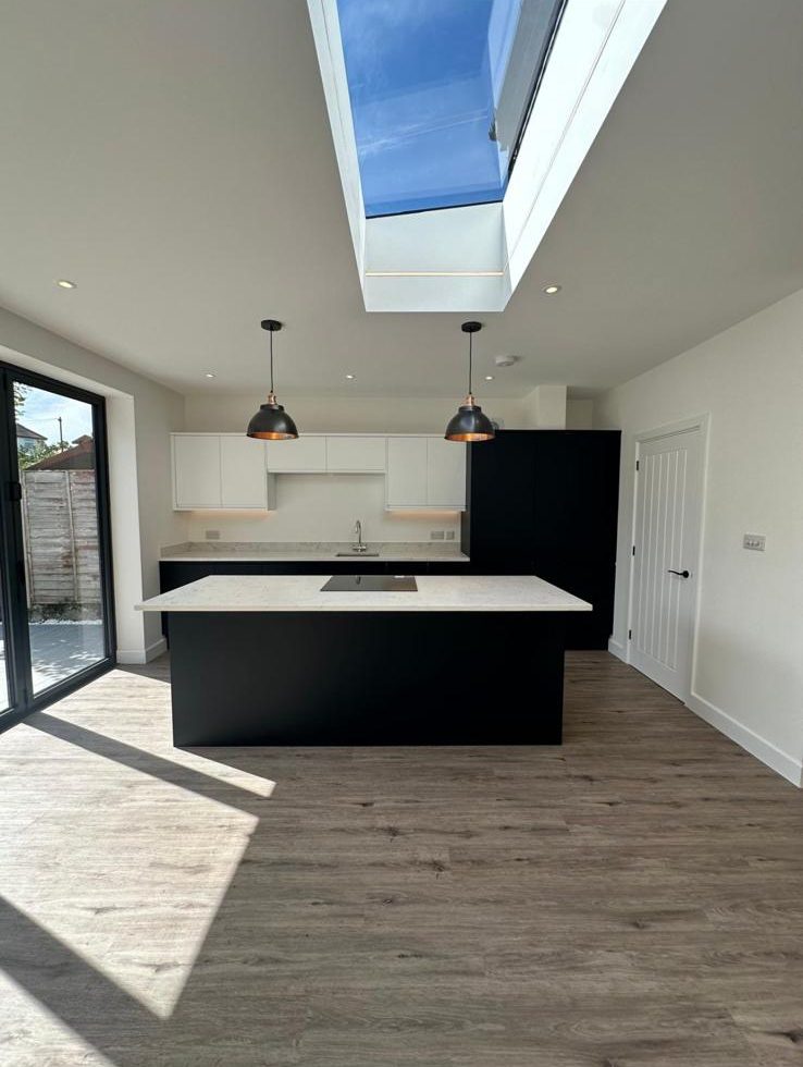 New black island kitchen fitted during a whole-house refurbishment, Chessington