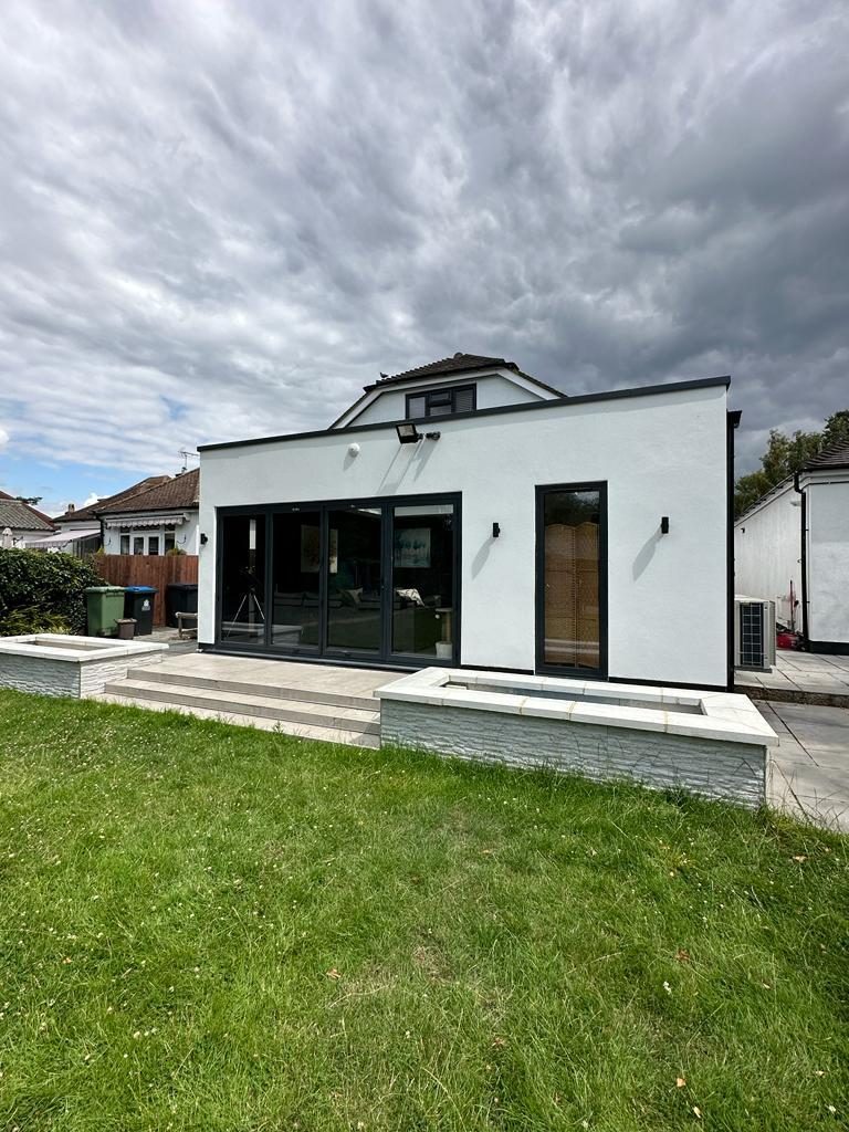 White rendered flat-roof extension with landscaped garden, Chessington
