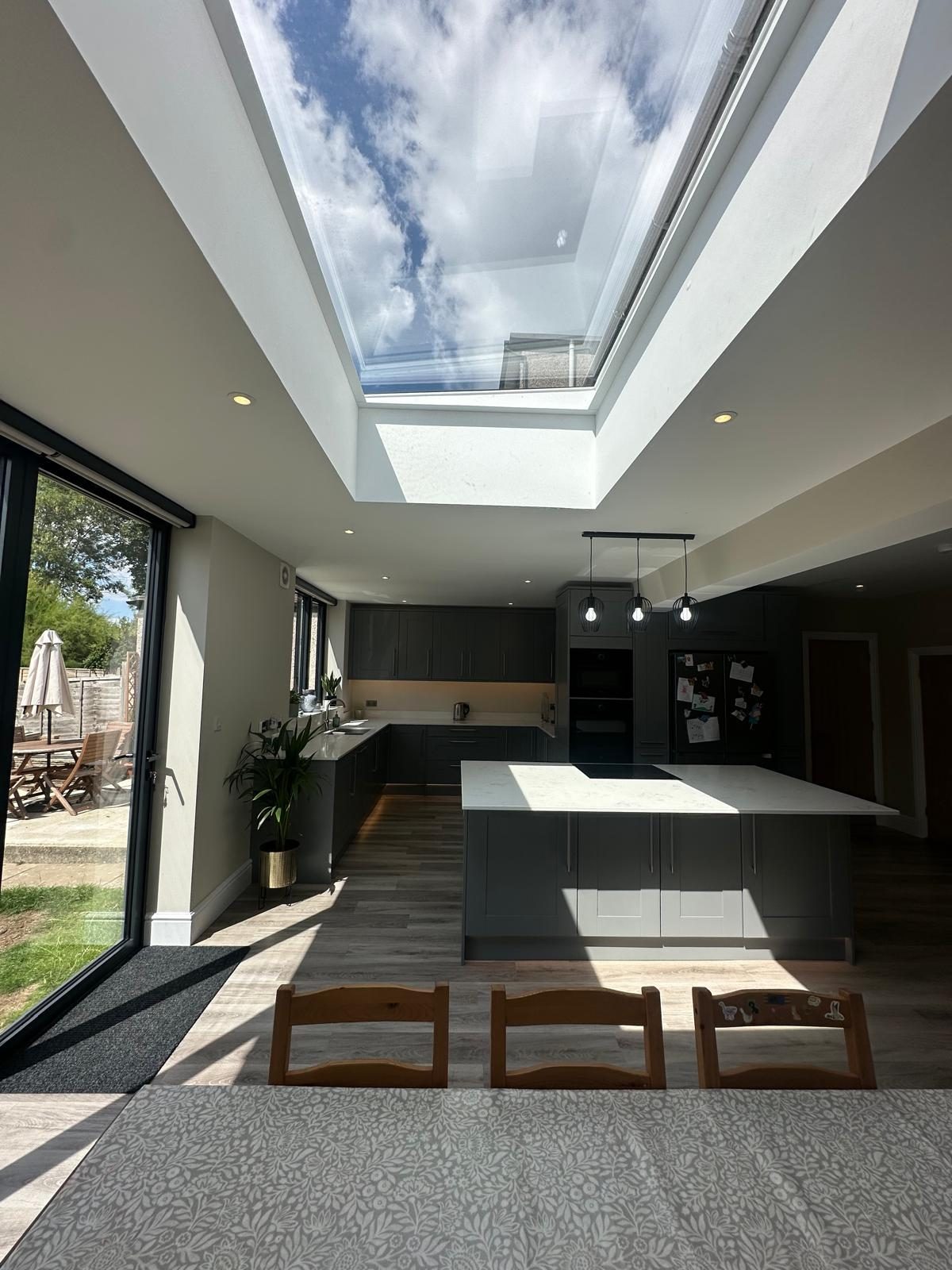 Extension interior with roof lantern and bifold doors to the garden, Epsom