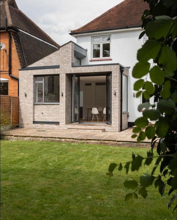 Rear elevation of a brick extension from the garden, Surbiton