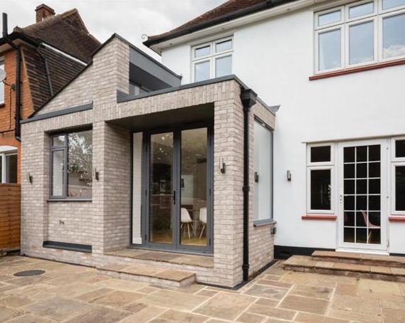Buff-brick rear extension with glazed corner, Surbiton