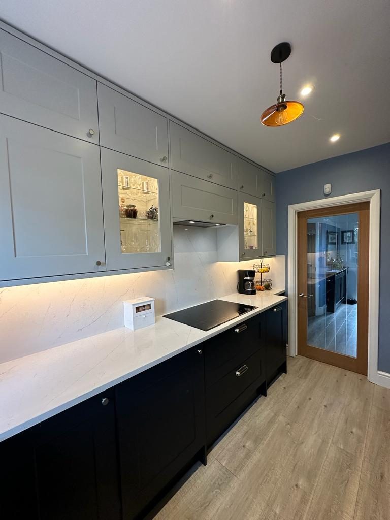 Full kitchen view with backlit glazed cabinets, Chessington