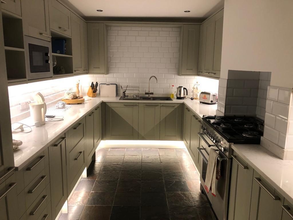 Sage shaker kitchen with under-cabinet lighting, Weybridge