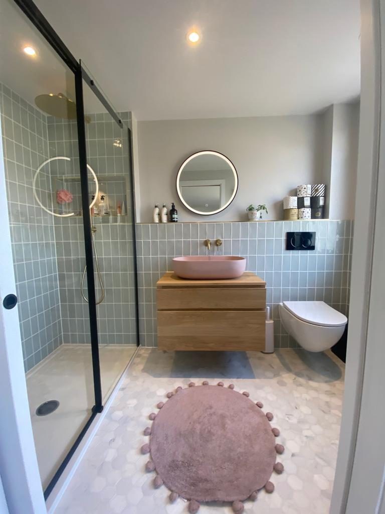 Loft conversion ensuite with black-framed walk-in shower